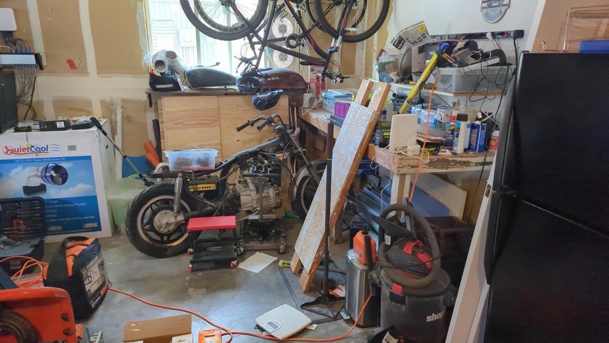 Sort and Haul Day in Bothell - a garage workshop full of tools and bikes before the Junk B Gone crew arrived
